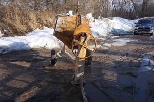 lot 1 image: Stone Tow Behind Gas Powered Commercial Cement Mixer