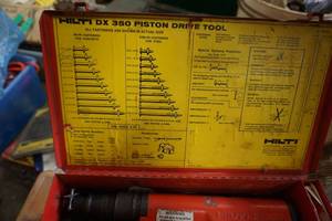 lot 17 image: Hilti Model DX350Heavy Duty Powder Actuated Nail and Stud Gun With Fasteners & Metal Case