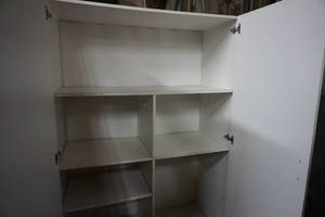 lot 63 image: Large Wood 2 Door Storage Unit With Internal Shelving