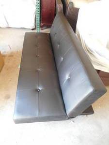 lot 35 image: DHP Nola Futon Couch with Tufted Faux Leather Upholstery, Modern Style, Black Faux Leather