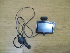 lot 108 image: Magellan Gps Unit with power cord and puck