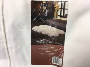 lot 191 image: Sheepskin Quad Rug Ivory, Retail $109.99