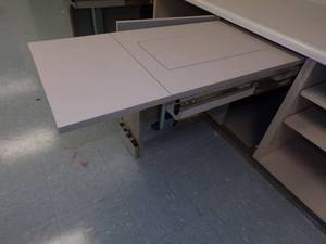lot 35 image: Fold a way Sewing machine Under counter slide out