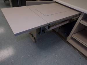 lot 36 image: Fold a way Sewing machine Under counter slide out