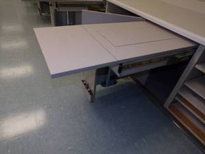 lot 38 image: Fold a way Sewing machine Under counter slide out