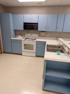 lot 44 image: 10 x 8 Kitchenette with sink, Stove, and Microwave with counter and cabinets