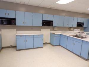 lot 46 image: 16 Kitchenette with Two Microwaves with counter and cabinets
