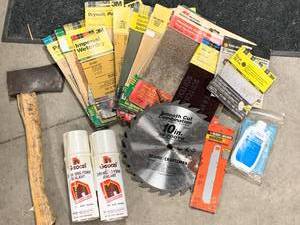 lot 57 image: Sandpaper, Sealant, Ax Blades