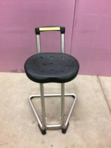lot 28 image: MSRP $350 Lyons Industrial Sit-Stand Stool helps to take up to 70% of your weight off your legs and feet Great Condition