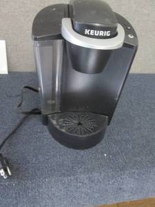 Keurig Coffee Maker powers on...