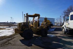 lot 5 image: 1989 Vermeer Model M495 4 x 4 Rear Mount Cable Plow