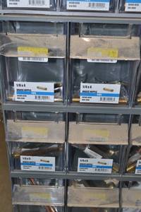 lot 2886 image: (2) Tip Out Storage Racks w Brass Pipe Nipples Inventory 34 to 18