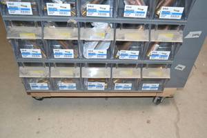 lot 2887 image: (2) Tip Out Storage Racks w Brass Pipe Nipples Inventory 1 to 18