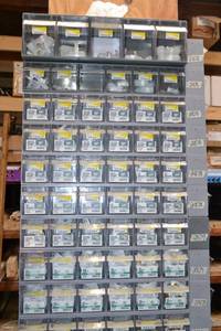 lot 2873 image: (7) Tip Out Storage Racks w 14 to 1 Plastic Hose Barb Hardware Inventory