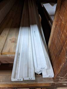 lot 2951 image: (8) Pieces of White PVC Garage Door Block Trim