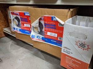 lot 2552 image: (2) Rolls Uncured Roof Flashing - Peel and Stick  (7) Tubes of LAP Sealant and (4) Boxes Ridge Cap Anchor Clips