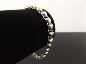 lot 43 image: .925 Sterling Silver Heart Charm Bracelet