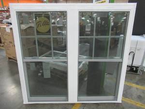 lot 200 image: Pella 250 Series Two Wide Double Hung Vinyl Window in White, Measures Approximately 56 14 X 60 14 X 2 Wall.