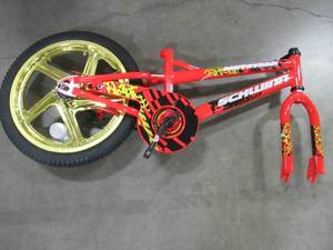lot 206 image: Incomplete 18 Red Boys Mototrax by Schwinn With Mag Wheels - Missing Training Wheels, Seat, Pedals, Front Wheel, Handle Bars and Chain. S0803WMDS