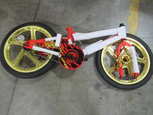 lot 210 image: Incomplete 18 Red Boys Mototrax by Schwinn With Mag Wheels - Missing Training Wheels, Seat, Pedals, Front Wheel Hardware, Handle Bars. S0803WMDS