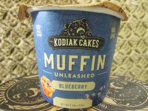 lot 214 image: 10 Kodiak Cakes Blueberry Muffin Un...