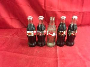 lot 178 image: 5 Christmas Coke Bottles