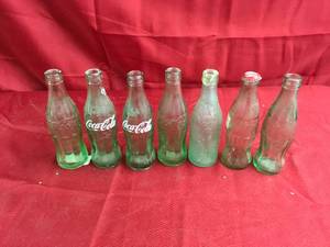 lot 180 image: 7 Misc Coke Bottles