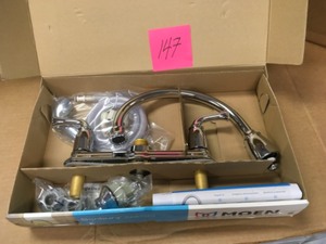 lot 147 image: Moen Banbury 2-Handle Mid-Arc Standard Kitchen Faucet with Side Sprayer in Chrome