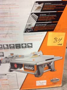 lot 84 image: RIDGID 6.5 Amp Corded 7 in. Table Top Wet Tile Saw USED