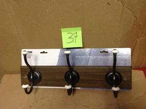 lot 37 image: Liberty 18 in. Ash Gray and Statuary Bronze Hook Rack with Ceramic Finials in good condition