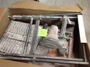 lot 81 image: RIDGID 9 Amp Corded 7 in. Wet Tile Saw with Stand USED in working conditions
