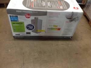 lot 120 image: Rheem Performance Plus 7.0 GPM Natural Gas Indoor Tankless Water Heater not used
