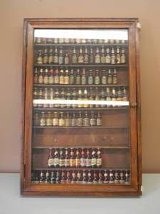 lot 1 image: AWESOME COLLECTION OF VINTAGE MINI SALT AND PEPPER SHAKERS AND MINI BOTTLES WITH VINTAGE DISPLAY CASE - ABOUT 110 PIECES - AWESOME GREAT COLLECTION - MUST SEE TO APPRECIATE - SEE PICTURES