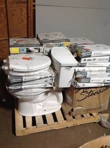 lot 10 image: PALLET OF AMERICAN STANDARD TOILET WITH TOILET COVERS.