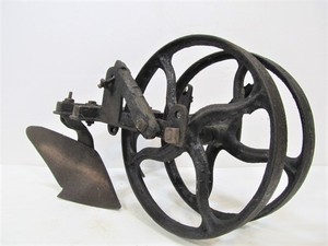 lot 225 image: Antique Cast Iron Farm Implement Cultivator Plow Wheel