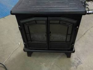 lot 319 image: Electric Fireplace- powers on and h...