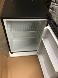 Magic Chef 2.4 cu. ft. Mini Fridge in Black Close not used whit small dent on the top cornerd