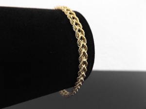 lot 55 image: 14k Yellow Gold Woven Rope Bracelet