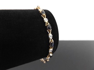 lot 56 image: 10k Yellow Gold Diamond Accented Marquis Cut Sapphire Bracelet
