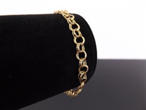 lot 57 image: 14k Yellow Gold Charm Bracelet