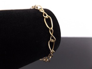 lot 58 image: 14k Yellow Gold Charm Bracelet