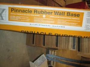lot 213 image: Pinnacle Rubber Wall Base 16 pcs Partial Box (4 X 48 X 18 sections) Y