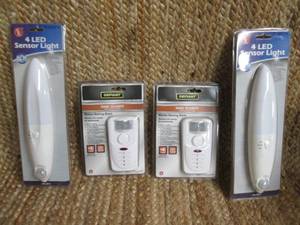 lot 239 image: (2) 4 LED Sensor Lights, (2) Defian...