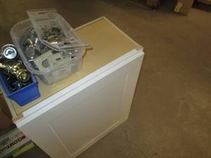 lot 371 image: Tote of Doorknobs, Door Hinges & Hardware & Wall Mount Cabinet Needs Tightening upon Install, See Photos