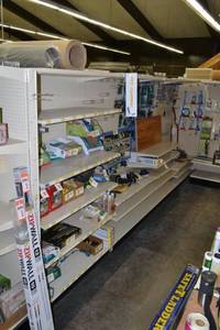 lot 1 image: Store Shelving - 4 Foot Double-Sided Sections with Peg Board Backing & Storage Drawer