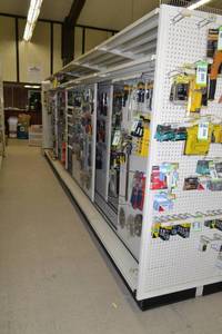 lot 4 image: Store Shelving - 4 Foot Double-Sided Sections Including Sliding Panels and Shelves with Peg Board Backing & Storage Drawer, End Cap Peg Board included.