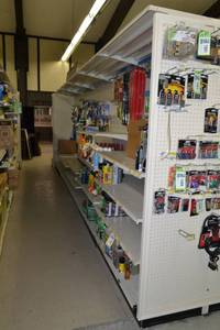 lot 5 image: Store Shelving - 4 Foot Double-Sided Sections Including Sliding Panels and Shelves with Peg Board Backing & Storage Drawer, End Cap Peg Board included.
