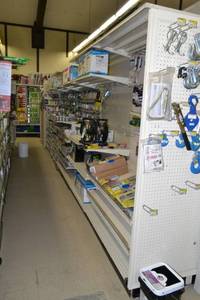 lot 6 image: Store Shelving - 4 Foot Double-Sided Sections Including Sliding Panels and Shelves with Peg Board Backing & Storage Drawer, End Cap Peg Board included.