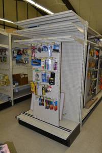 lot 10 image: Store Shelving - 4 Foot Single Sided Section Including Sliding Panel and Shelves with Peg Board Backing & Storage Drawer