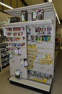 lot 11 image: Store Shelving - 4 Foot Single Sided Section Including Sliding Panel and Shelves with Peg Board Backing & Storage Drawer